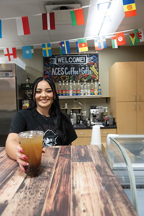 Top: Manager Destyni Marquez serves up a refreshing beverage at ACES Coffee and Gifts, located inside Gerald Thomas Hall on the NMSU campus. Bottom: Atlee Musgrave, a senior at NMSU, browses some of the merchandise the shop has to offer.