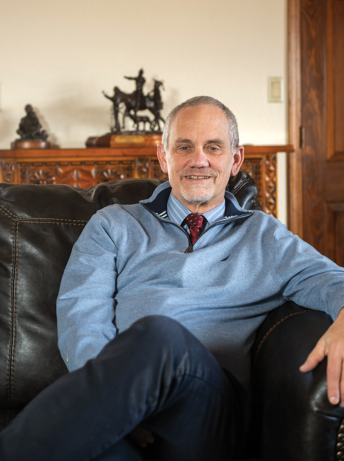 Top: NMSU President Valerio Ferme relaxes at home in the NMSU Residence.