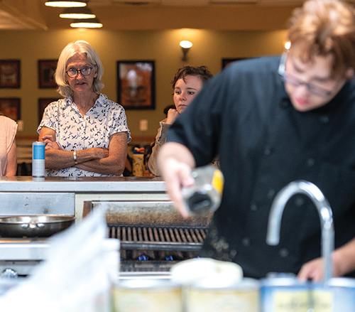 Spectators watch from the Westside Bistro dining room as chefs compete in a 575 Food Fights event. 