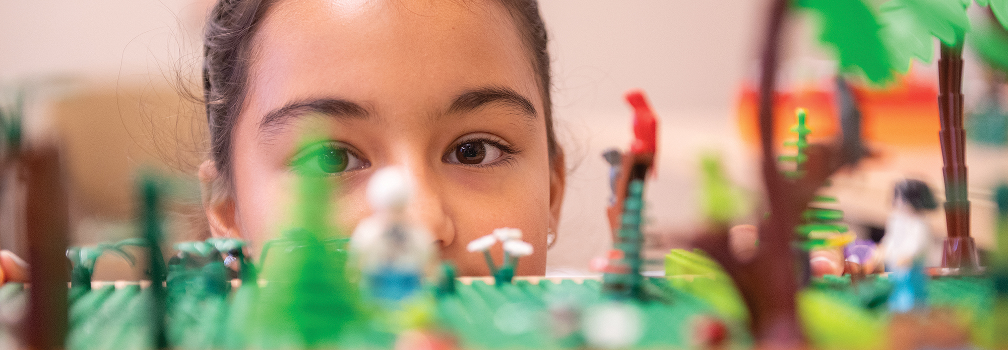 Maria Adeliz Ordoñez, NM State Robotics club  president, works on a robot in Jett Hall.