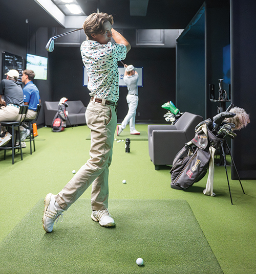Brent Barker and classmates practice and compete in NMSU’s updated Professional Golfers’ Association Golf Management program golf lab, where Trackman 4 technology supports both game improvement and the camaraderie that defines the program. 