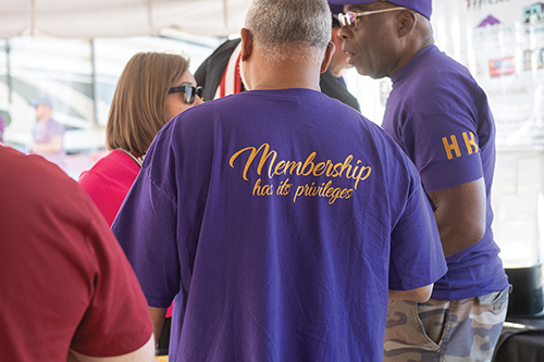 Omega Psi Phi members attend the Aggie football tailgate. 