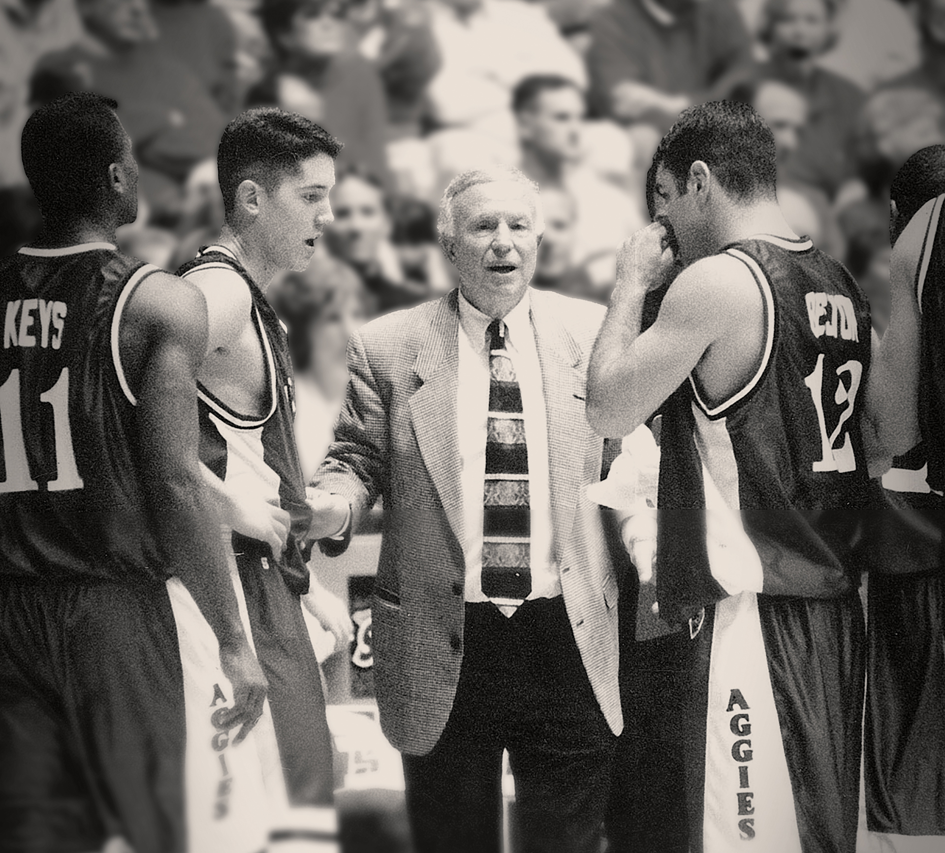 A coach speaking to his basketball players