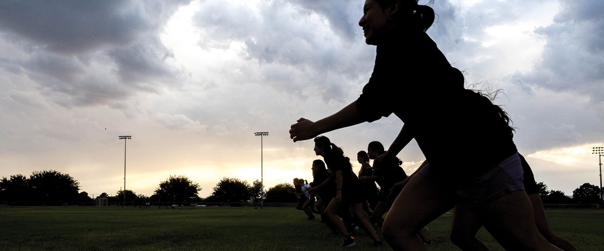 Women's ruby practice at sunset. 