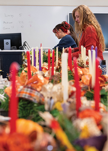 Sabrina Montoya (left) and Sabine Green, floricul­ture program coordinator, make Thanksgiving centerpieces. NMSU’s floral team was rees­tablished in 2003 when Green became faculty adviser.