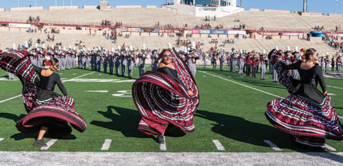 Robles Gil, Ari Almada and Hannah Valdez perform during a Homecoming event in 2022, the group’s inaugural year.