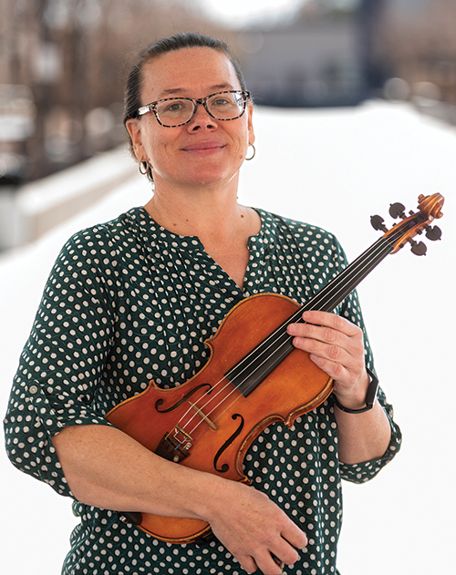 Top: Jennifer Rogers, Las Cruces High School orchestra director, was named the New Mexico Music Educators Association Educator of the Year and received a 2025 National Federation of High School Associations Outstanding Music Educator Award. Bottom: Rogers works with an ensemble during a rehearsal.